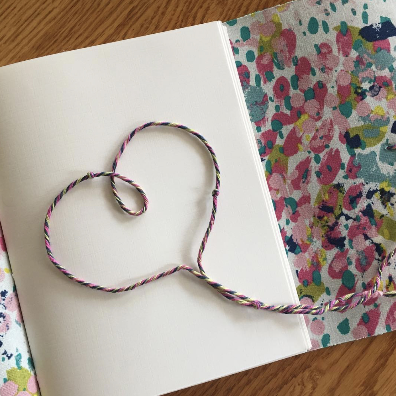 handmade rope in heart shape inside journal