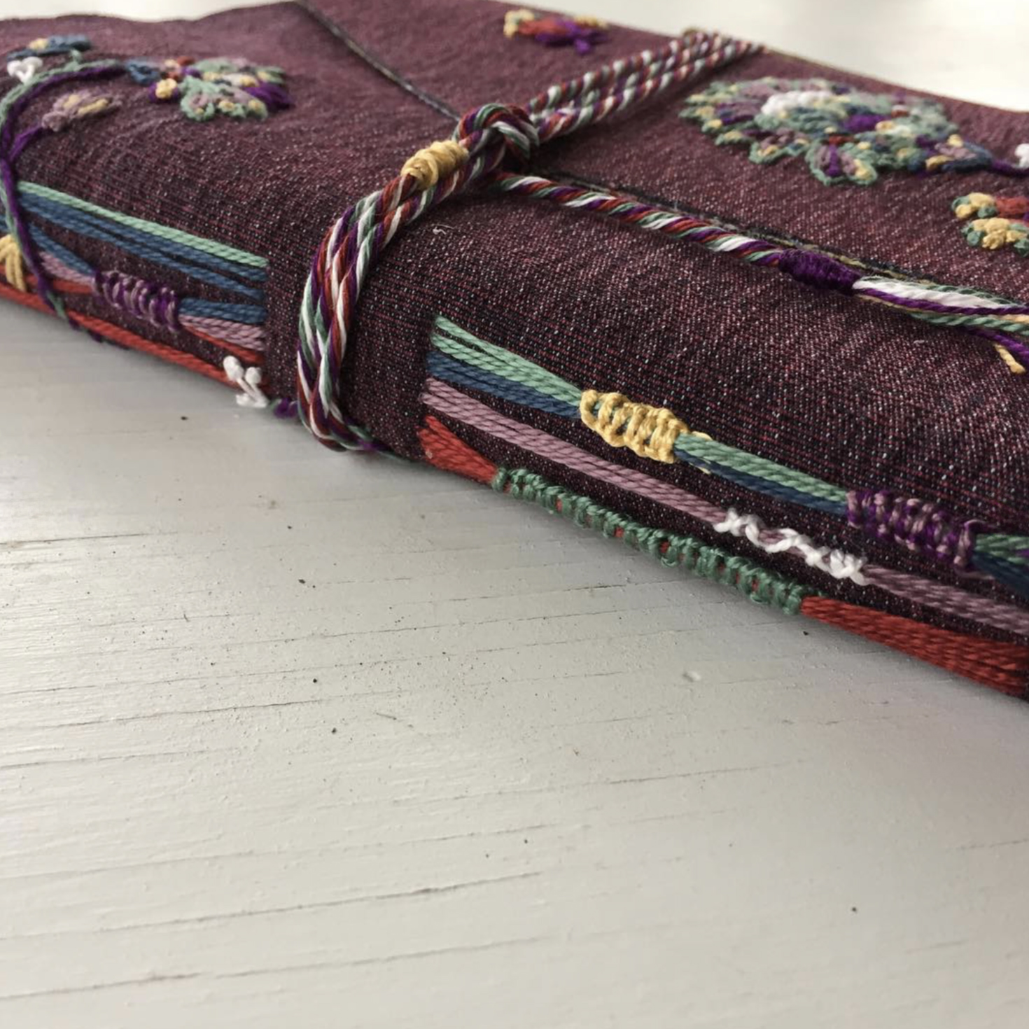 spine view purple denim journal embroidered rope tied